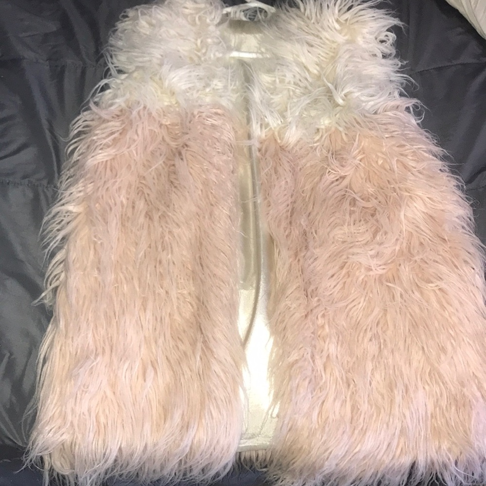 Light pink & white fur vest.